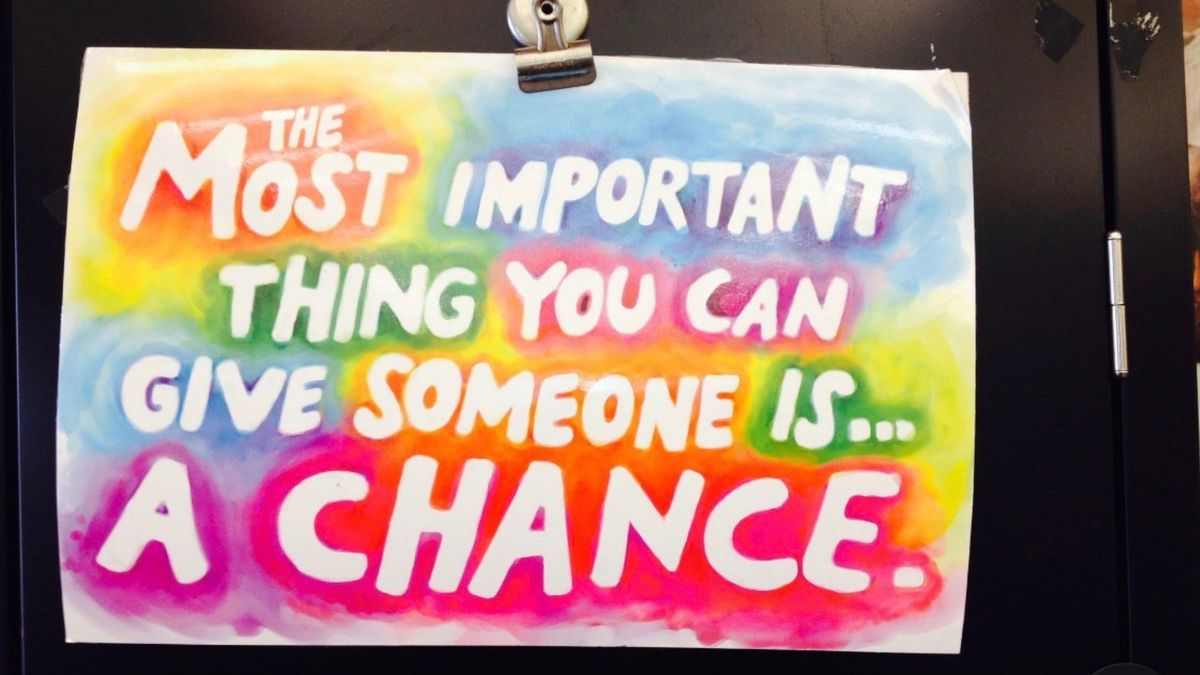 Inspirational sign reading: the most important thing you can give someone is a chance