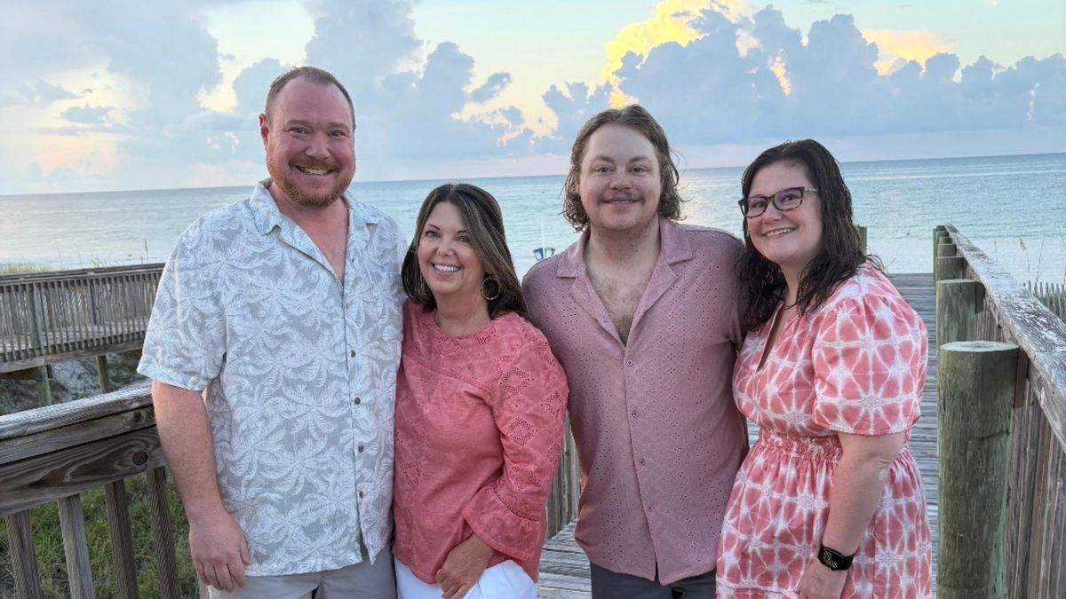 Family photo on the beach at sunset