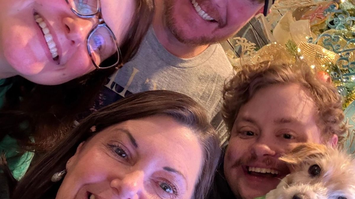 Family selfie by the Christmas tree
