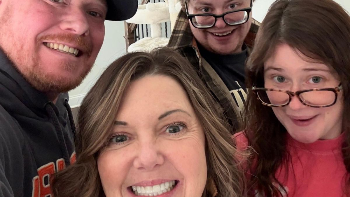 Tina and family taking a selfie at home